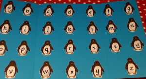 penguin folder with lower case letters on