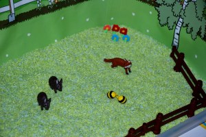 garden habitat tray with toy animals