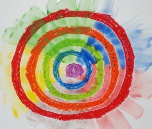 Kids oil pastel with water colour wash over the top