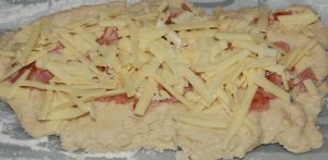 adding the bacon and cheese to the scones