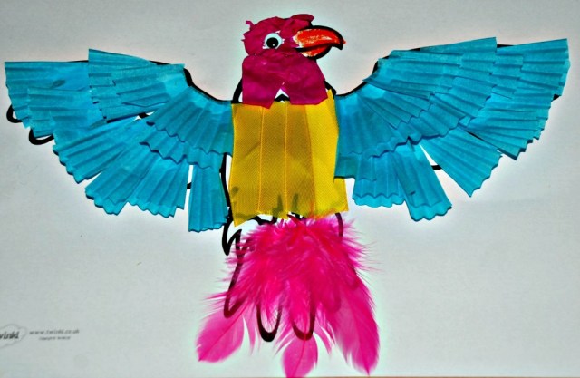 Animal collage craft made using a free to dwonload colouring pages and some basic crafting goodies