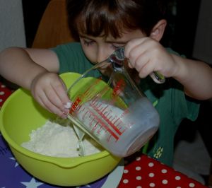Helping with the pouring when making scones