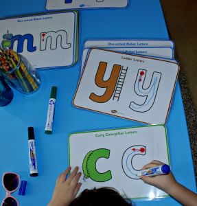 Letter formation posters laminated and using white board marker pens