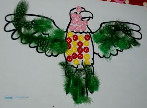 Parrott mosaic using craft feathers and buttons included in the animal mosaic post on ofamilyblog