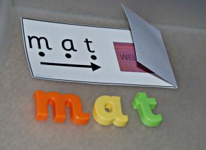 Read and reveal cards with some magnetic letters