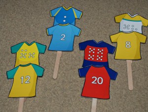 Rugby Tops from Twinkl attached to craft sticks