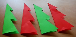 Fold the Christmas tree shapes in half before you start glueing them