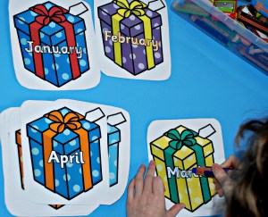 Writing months of the year on laminated present sheets with STABILO pencils