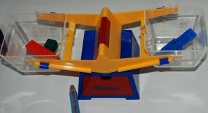 Using our Learning resources scale to make sure our snap cubes on either side are balanced