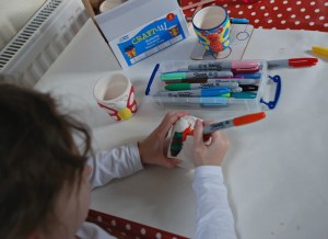 Butterfly ceramic flowerpots decorating them with Sharpies