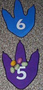 Dinosaur footprints with dinosaur eggs added