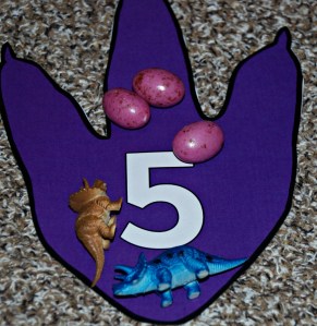 Dinosaur maths 2 dinosaurs plus 3 eggs equals 5