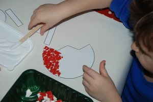 Sticking the eggshelld onto the cut-out Tulip from Activity Village