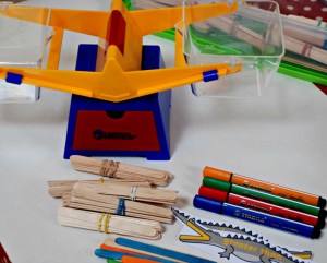 weighing craft sticks to work out which number is greater