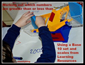Working out which numbers are greater than or less than using a base 10 set and a scale