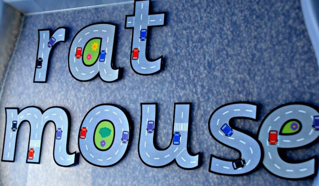 building basic words with the FREE to download road themed letters from Twinkl Resources