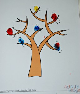 Birds on the Activity village tree page. Birds are finger painted and then details added with a felt tip pen