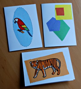 Cards made by young kids using the cutting skill pages from Twinkl