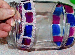 Decorating bottles with sharpies, pritt all purpose glue and some coloured sand