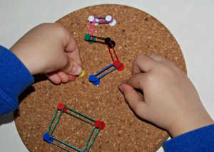 Number formation using loom bands and draiwing pins on our cork coasters