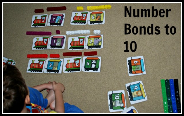 Figuring out number bonds to 10 using train cards from Twinkl and snap cubes on ofamilyblog