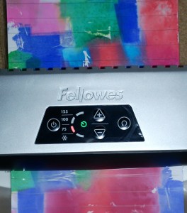 Laminating our patterned spelling and writing pages