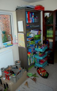 the-kids-play-area-with-another-bookcase-some-toys-and-their-art-cart