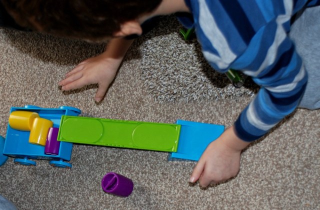 Learning Resources simple machine set moving barrels onto the cart