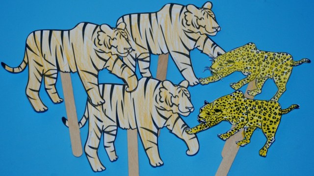 Animal stick puppets printed out in black and white and coloured in by the kids