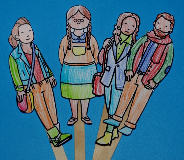 My family stick puppets printed in black and white and then coloured in by the kids