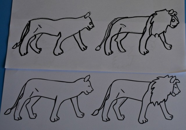 Tracing over the lion stick puppet templates to create a whole pride of lions