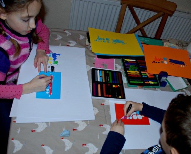 Easy art activity for younger kids using train stencils and oil pastels