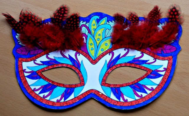 Mardi Gras colouring mask with some feathers added