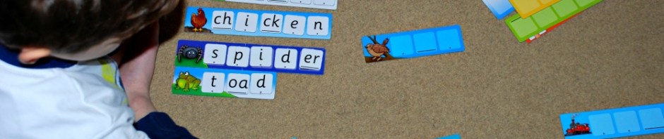 Practicing spelling word with the Orachrd Toys Match and Spell Next steps game
