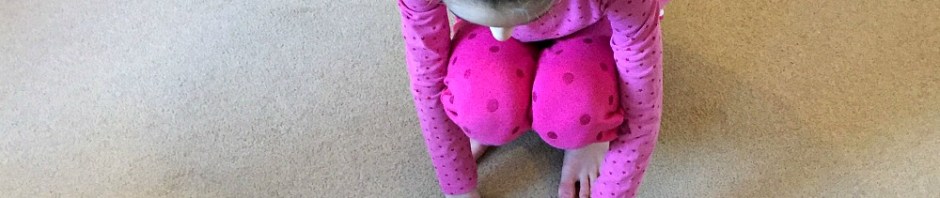 practicing times table by throwing a bean bag and then answering the sum