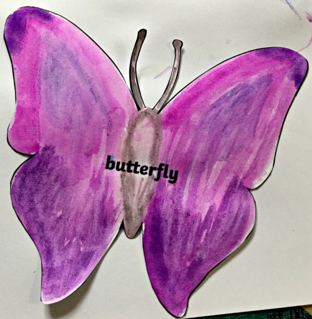 Butterfly shadow stick puppet downloaded from Twinkl website and painted with some water-colours