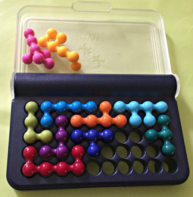 IQ fit a Smart Game which involves placing the 3D pieces into the empty holes in a manner which results in no holes been left open