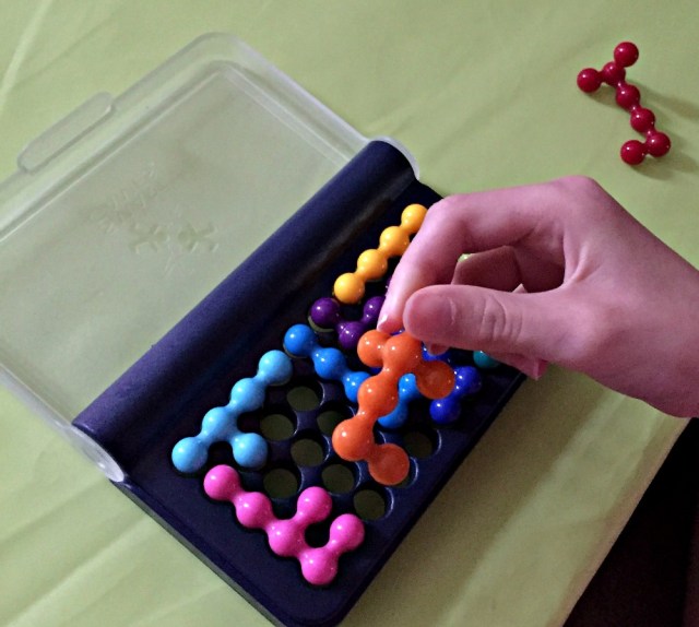 IQ fit. The 3 dimensional pieces can be twisted and rotated to fit into the holes