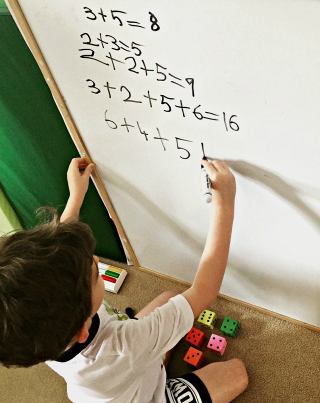 Creating sums using foam dice. A fun, relaxed way for children to practice basic maths