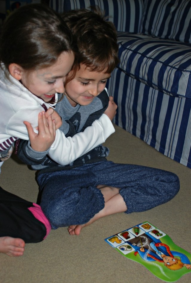 Playing Magic Maths by Orchard Toys. The player who fills their board with the ingredients is the winner