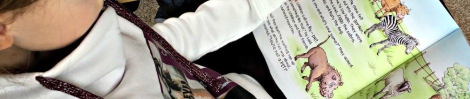 Reading Rescuing Rhino together. A sweet fictional story about a baby rhino who is rescued and rasied by a young family