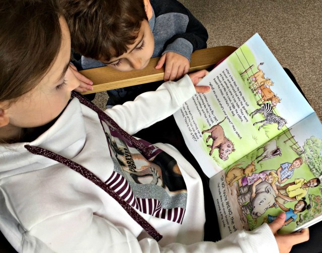 Reading Rescuing Rhino together. A sweet fictional story about a baby rhino who is rescued and rasied by a young family