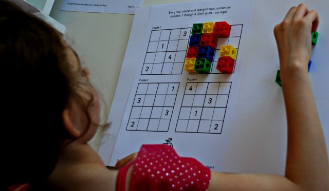 Practicing Sudoku using snap cubes to create a colourful pattern