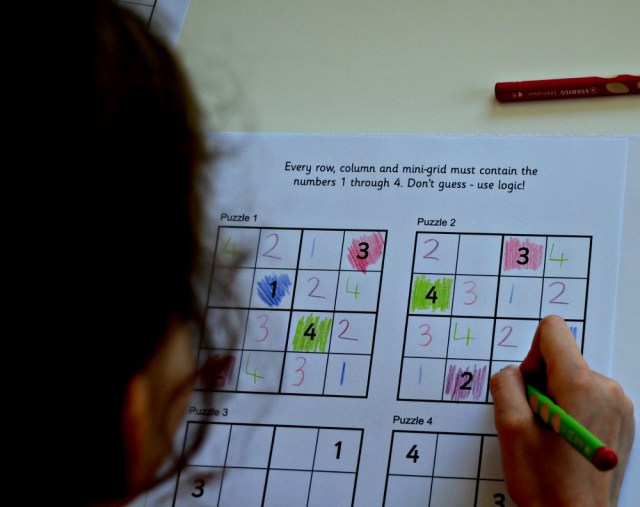 Solving the Activity Village sudoku puzzles by using coloured pencils to help create a pattern