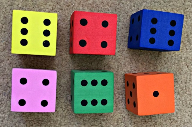 Using Foam dice to help the kids practice regrouping numbers within a sum to make it easier to solve