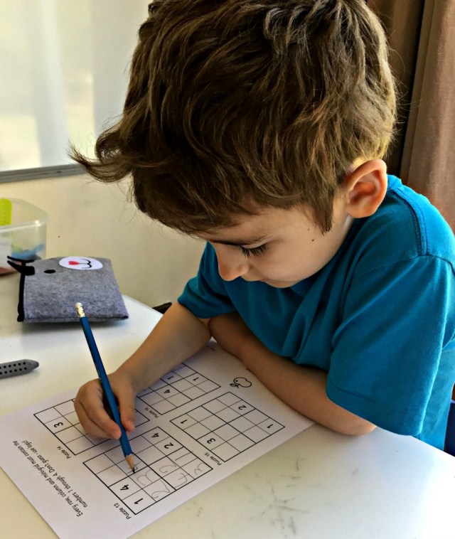 Working on a Sudoku puzzle from the Activity Village Sudoku pack. lots of examples for the kids to try