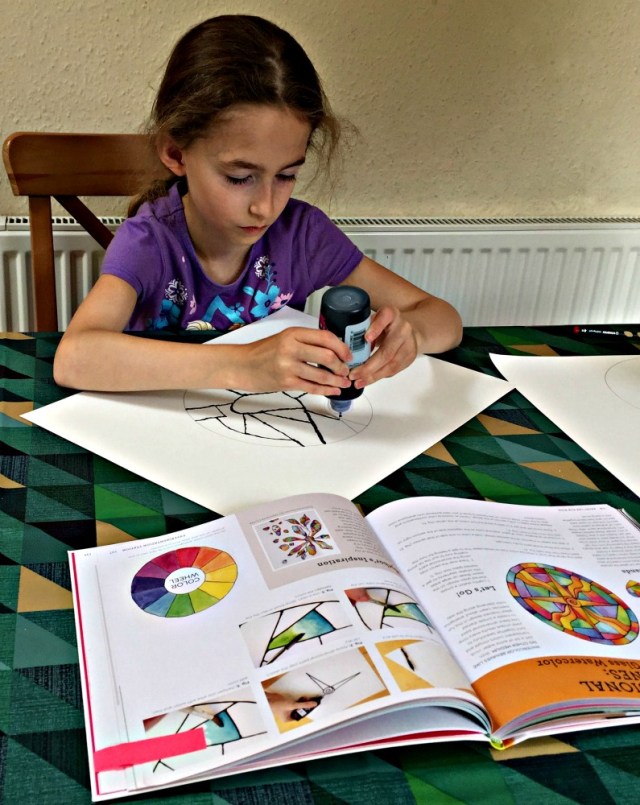 Creating the dimensional outline for the stained glass window art project. Idea inspired by Paint lab for kids