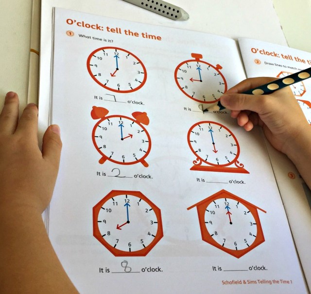 Telling the Time 1 by Schofield & Sims contains lots of examples to practice telling the time for o'clock, half past, quarter past and quarter to