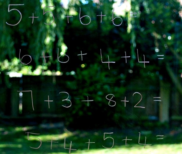 Keeping Maths Fun. Writing sums on sliding doors and windows at home