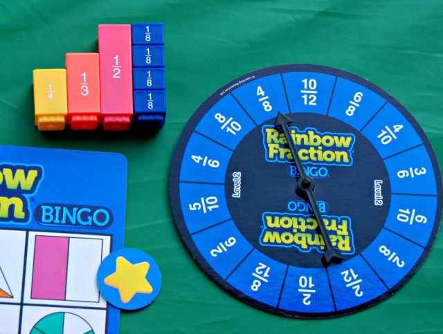 Rainbow Fraction Bingo game. Using the Equivalent fraction Tower pieces to help the younger kids work out the answer